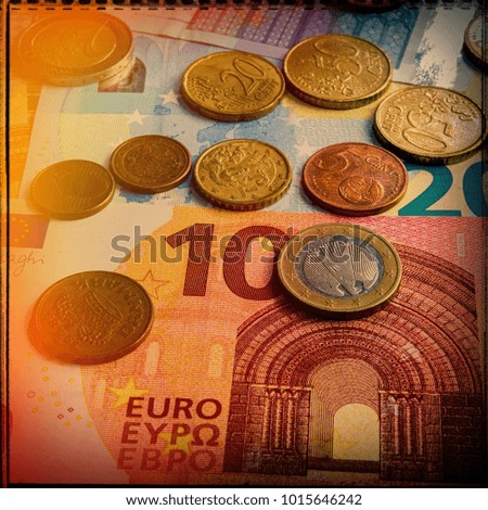 paper euro banknotes and coins. Currency of the European Union.
