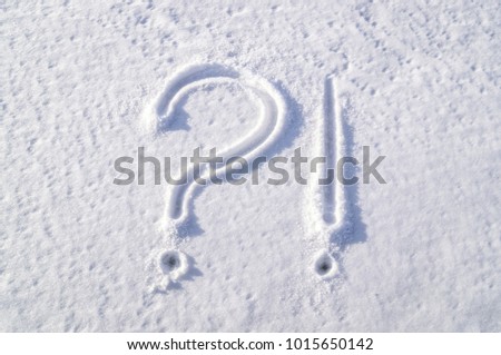 Picture on the snowy window. Symbols - question and exclamation mark