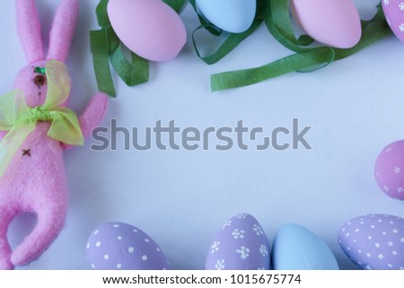 Colorful eggs and Easter Bunny on white background. Space for text