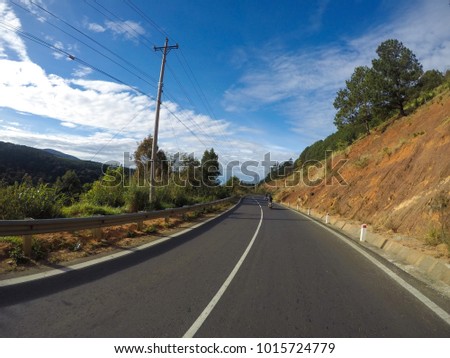 Royalty high quality free stock image of road on the pass, Da lat city, Vietnam. The road is very quiet and the weather is beautiful