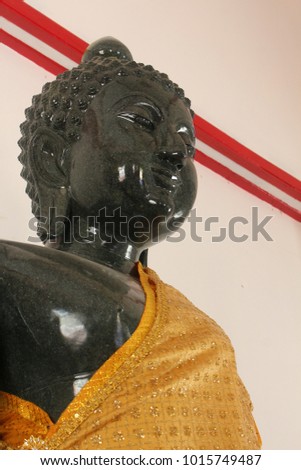 The Buddha carved from black marble. The temple in northern Thailand.