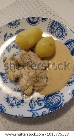Cod fish with sauce and potatoes