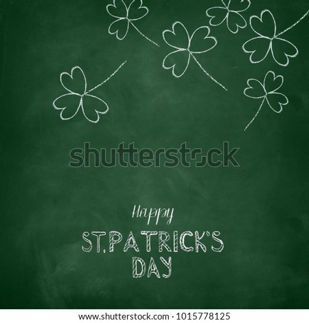 Happy St. Patrick's Day written on a green chalkboard