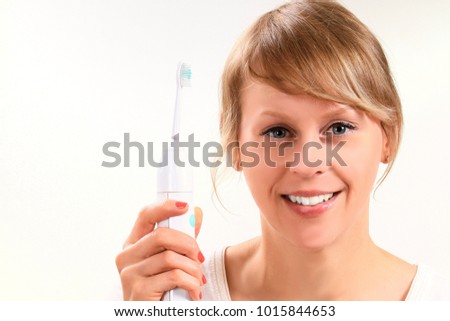 woman brushing her teeth on white 
 background stock image stock photo