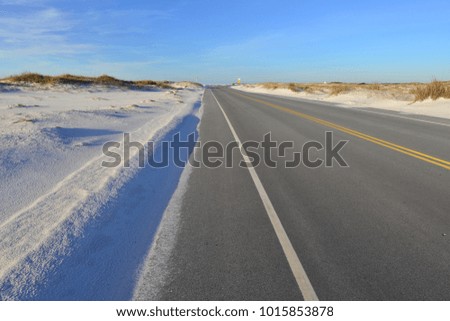 A coastal road on the Pensacola beach area.