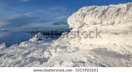 Wonderful winter landscape on a sunny day. Unreal, fantastic, mystical, frozen texture with frost, ice and snow look like waves of the ocean. Incredible silhouette and form.