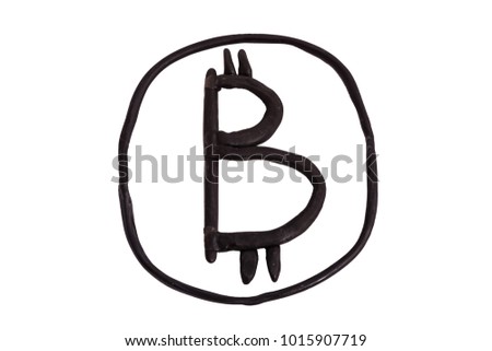 Bitcoin is made by hand from black plastic, isolated on white background. Unique image, concept.