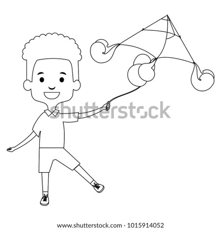 cute and little boy flying a kite