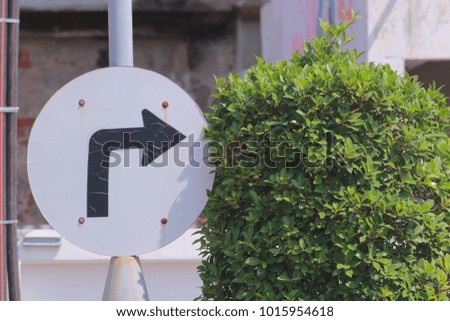 sign in natural with a tree