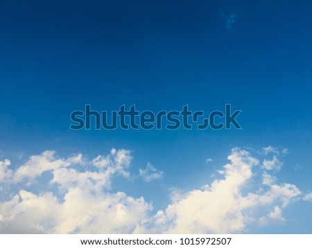 Blue sky and white clouds with space for your text and design.Concept be used for freedom of think and life,