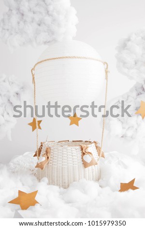 Digital background for newborn and children photography. White hand made air balloon in the clouds with the stars. White clouds. Valentines day decorations.