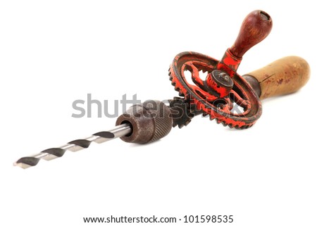 Stock Photo of manufactured before the W.W.II. Vintage (Antique, Old) Hand Drill with Drill Bit over white background.