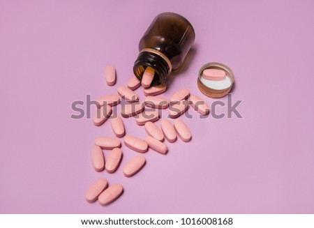 medicines for the patient. medicine and health. treatment of the disease. bright tablets. lilac background