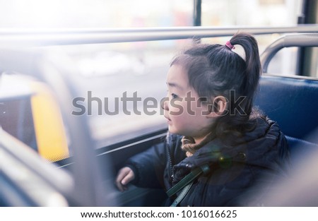 Lovely young asian girls on the bus