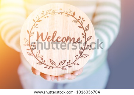 Welcome word with kid hand concept idea design for poster invitation decoration home.School kid holding Welcome back to school party.Entrance welcome speech onboarding office team.kid child invite.