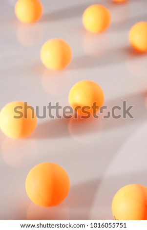 A STILL LIFE OF TABLE TENNIS BALLS, RACKET, NET ON A WHITE BACKGROUND