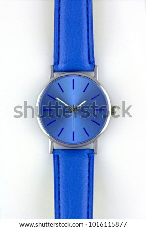 Chromium-plated metal wristwatch with navy blue dial and leather stitched wristlet isolated on white background, logos removed. Available space for logo and text