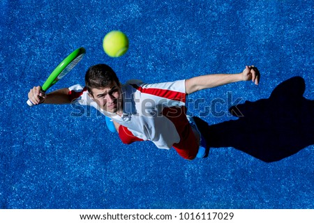 Aerial view of a young man playing paddle Royalty-Free Stock Photo #1016117029