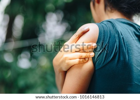 Shoulder Injuries , Woman with pain in shoulder and upper arm ,Ache in human body , office syndrome , health care concept Royalty-Free Stock Photo #1016146813