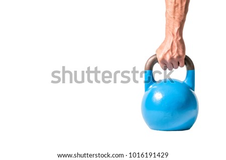 Strong muscular man hand with muscles holding blue heavy kettlebell ready for hardcore workout cross training partially isolated on white background