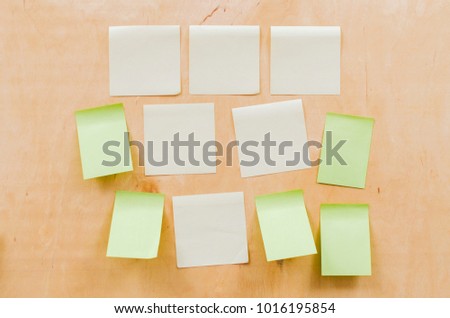 Paper note on wood texture background