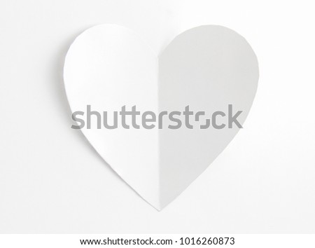 Heart shaped white paper in white background, Heart cut from white paper, Valentines Day background, Holiday Card, Romantic atmosphere
