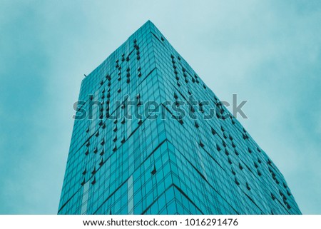 Tall blue glass building