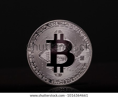 Silver bitcoin on a black background