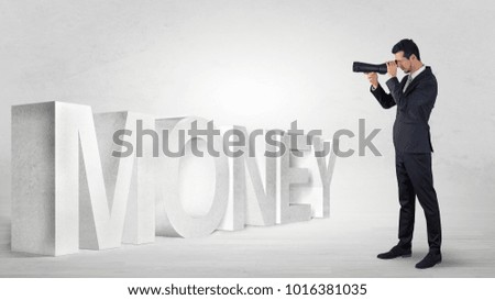 Handsome businessman looking forward with binoculars at a job, income and money concept
