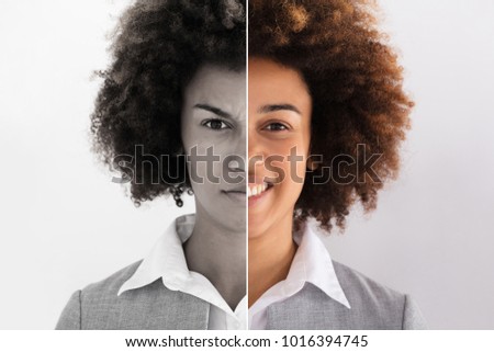 Portrait Of A Young Businesswoman Showing Sad And Happy Emotions Royalty-Free Stock Photo #1016394745