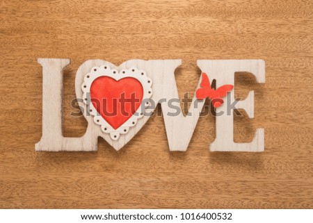   Love sign on wooden background