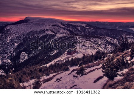mystic winter landscape of mountain and sunset or sunrise. Ceahlau, Romania