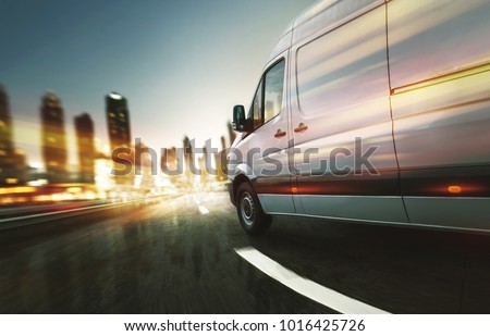 Delivery van delivers at night Royalty-Free Stock Photo #1016425726