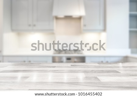 Modern bright kitchen with a white wooden countertop Royalty-Free Stock Photo #1016455402