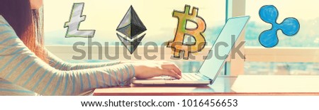 Cryptocurrency with woman working on a laptop in brightly lit room