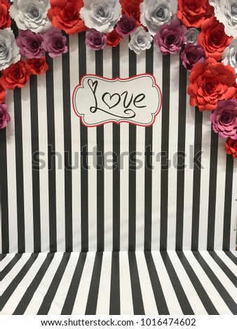 black and white banner with paper flowers. Valentine's day decor