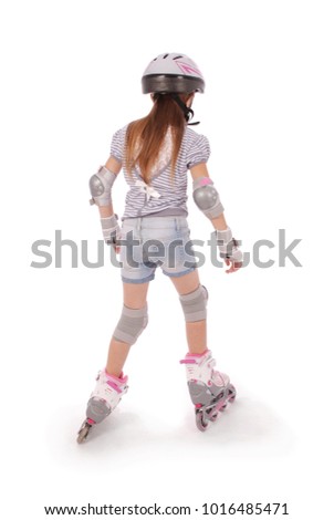 Little pretty girl on roller skates against white background