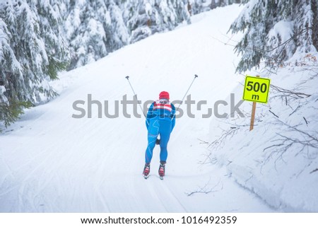 Professional nordic ski race, cross country competition, athlete in white winter nature. Original sport photo, winter game, South Korea 2018