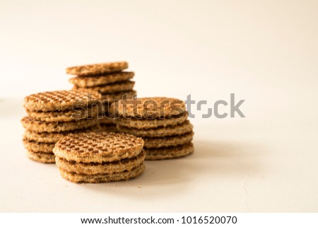 typical Dutch food cookie stroopwafel, against white background 