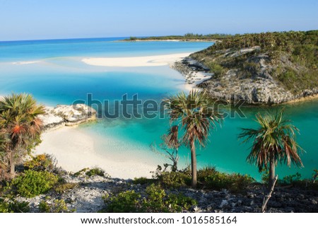 A small paradise beach located on Shroud Cay in the Bahamas.  Shroud Cay is part of the Exuma island chain and the Warderick Wells Land and Sea Park.  Perfect, isolated beach. Royalty-Free Stock Photo #1016585164
