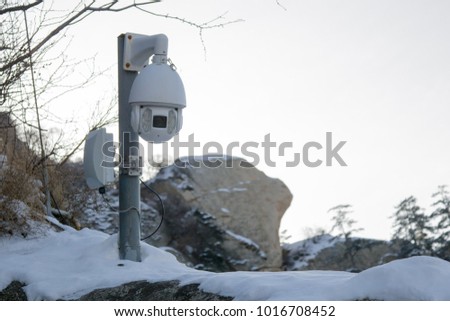 CCTV cameras with snow covered on blue  sky background