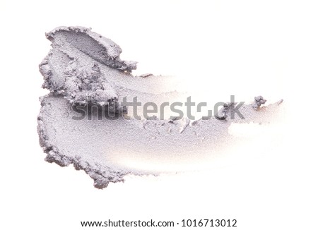 Smear of light gray cream for the face or cosmetic clay on a white background. Texture of gray cosmetic face mask isolated on white background