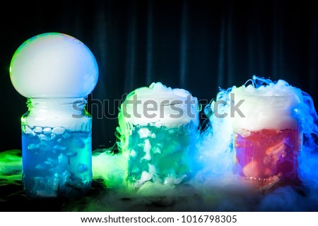 Soap bubble on a glass jar. Dry ice in the water. Evaporation of dry ice is converted into a soap bubble.