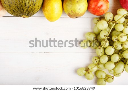 fruit background with exotic fruits on white background, fruit detox, space for text