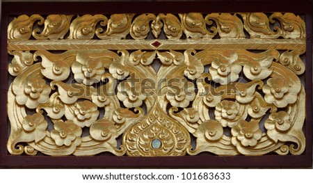 Gold wooden crave in Thai temple