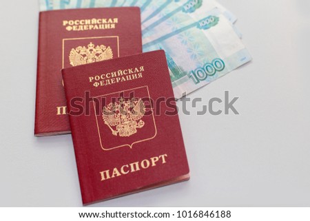 Russian passport with money on white background