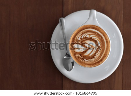 Mocha coffee with flower and heart pattern with copy space for text, decoration image for coffeehouse or for menu picture