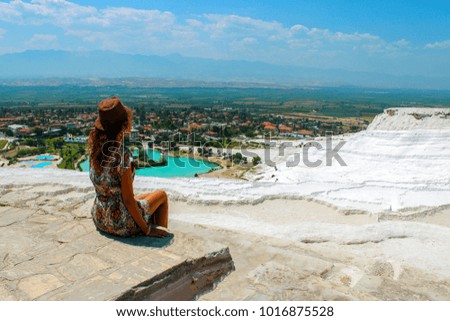 Woman take a picture of beautiful hill and village nature top view in Turkey.