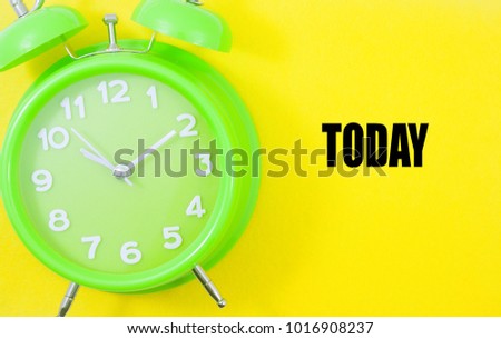 alarm clock with text today isolated on yellow background