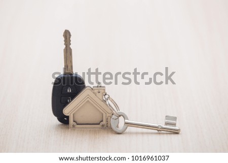 Car and house keys on table. Concept of success.